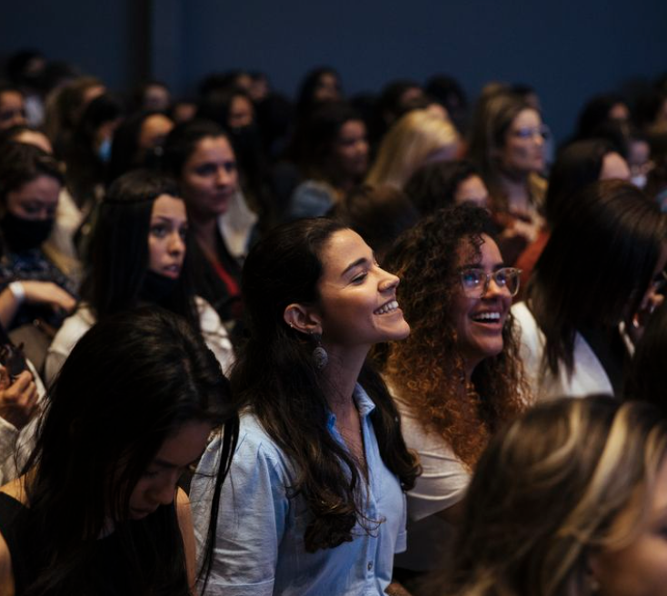Attendees smiling at an Aho.connect event